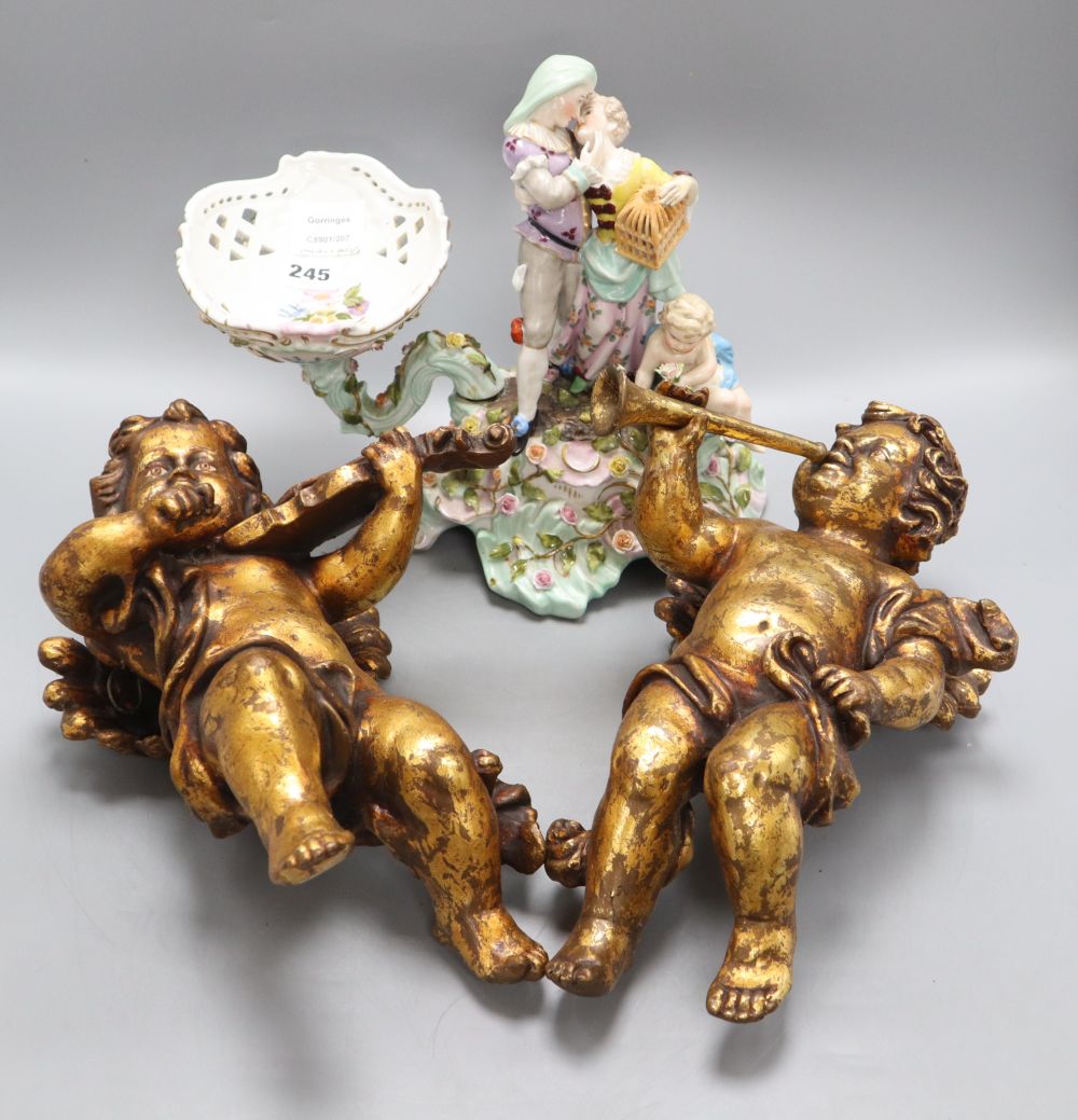 A pair of plaster cherubs and a Sitzendorf porcelain centrepiece